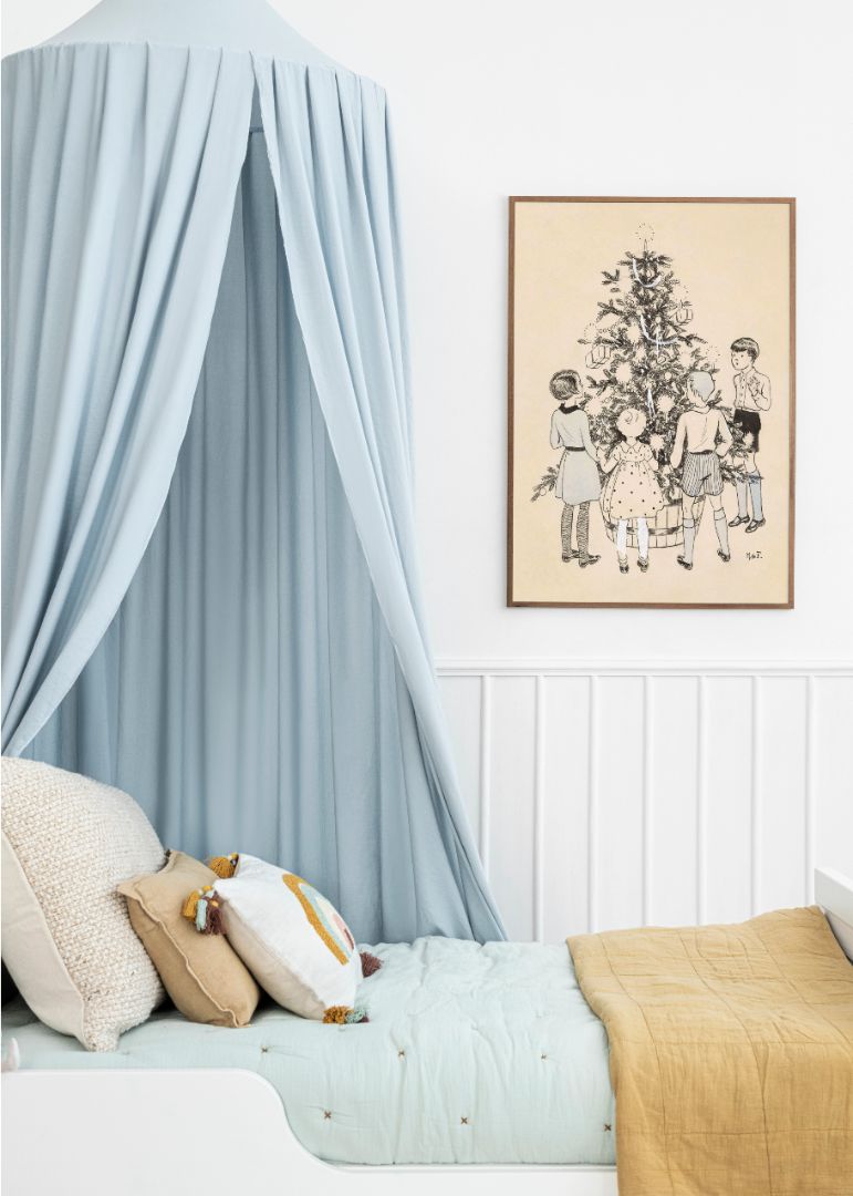 Four children around a Christmas tree