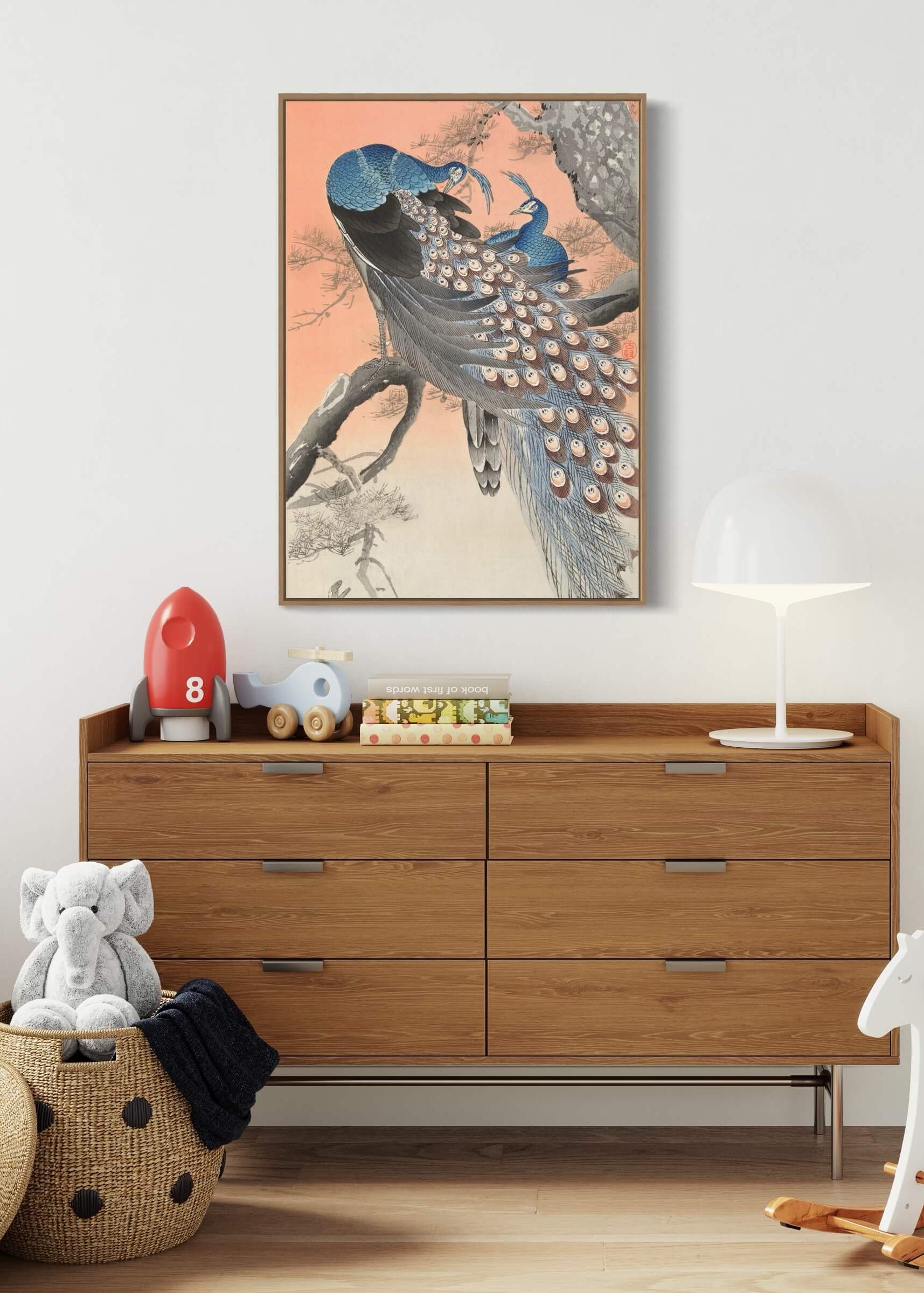 Two peacocks on tree branch