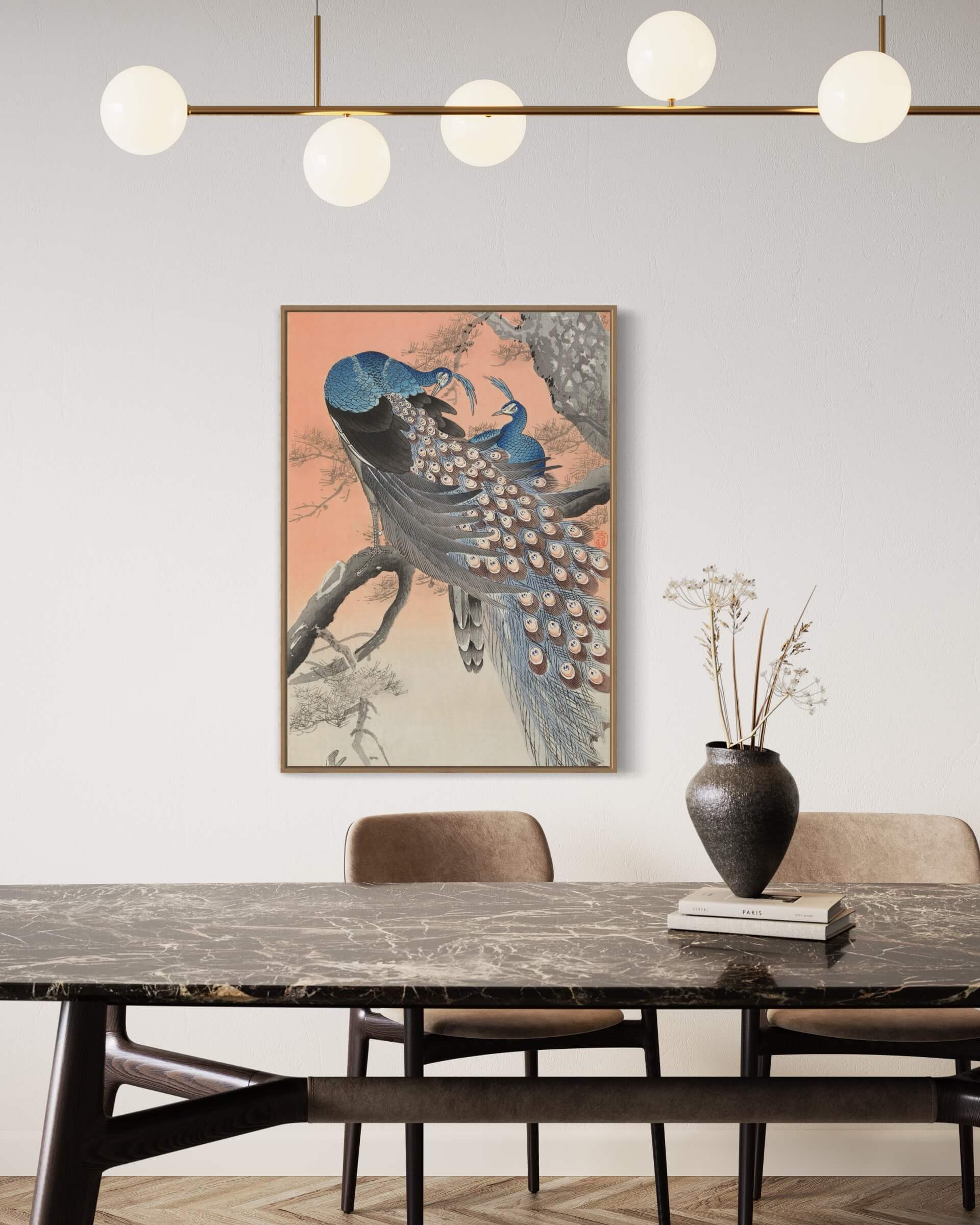 Two peacocks on tree branch