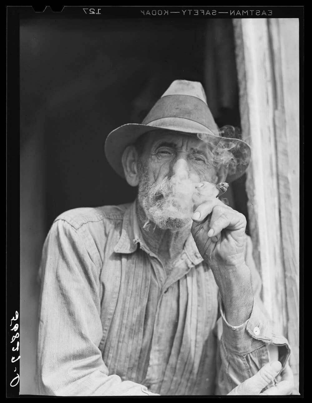 Spanish muskrat trapper in doorway